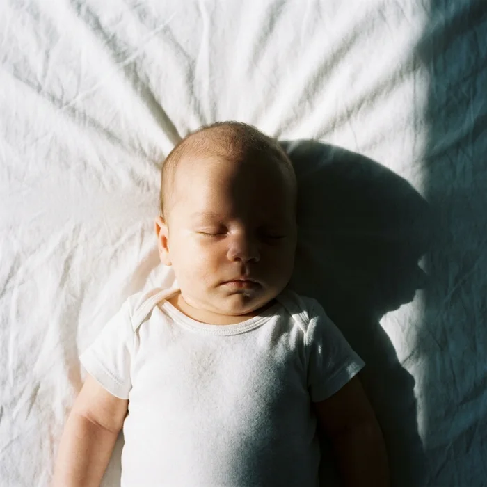 Rejected baby passport photo example — shadow across the face