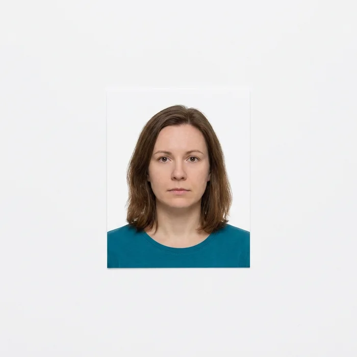 Rejected passport photo — refused — framed too loosely, head under the minimum